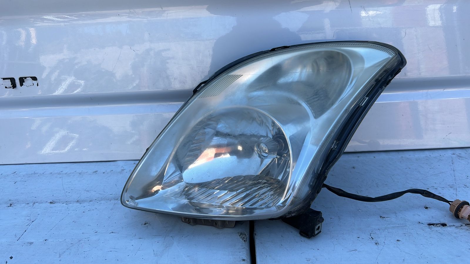 OPTICO IZQUIERDO SUZUKI SWIFT (06-10)